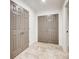 Hallway with tile flooring, doors and neutral wall paint at 3916 Green Forest Se Ln, Smyrna, GA 30082