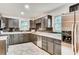 Well-lit kitchen featuring stainless steel appliances and dark cabinets at 3916 Green Forest Se Ln, Smyrna, GA 30082