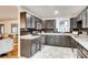 Stylish kitchen with dark cabinets, stainless appliances, and sleek backsplash at 3916 Green Forest Se Ln, Smyrna, GA 30082