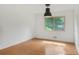 Bright, open living room with hardwood floors, large window and natural light at 3916 Green Forest Se Ln, Smyrna, GA 30082