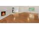 Spacious and bright living area with a fireplace and hardwood floors at 3916 Green Forest Se Ln, Smyrna, GA 30082