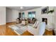 Bright living room features a fireplace, hardwood floors, and stylish decor at 3916 Green Forest Se Ln, Smyrna, GA 30082