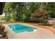 Backyard oasis has a refreshing swimming pool with plenty of room for entertaining at 3916 Green Forest Se Ln, Smyrna, GA 30082