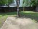 Picture of a fenced backyard with a concrete patio and mature tree at 615 Waynes Se Ct, Atlanta, GA 30354