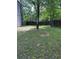 Photo of a grassy backyard with a patio and wood fence at 615 Waynes Se Ct, Atlanta, GA 30354