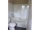 Full bathroom including a shower-tub combo and a toilet; modern and clean at 615 Waynes Se Ct, Atlanta, GA 30354