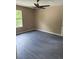 Bedroom featuring dark floors, light-colored walls, and a fan with a window for natural light at 615 Waynes Se Ct, Atlanta, GA 30354