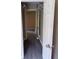 Hallway with wire shelving storage visible; neutral color scheme at 615 Waynes Se Ct, Atlanta, GA 30354