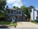 Two story home with a well-maintained lawn and a paved driveway at 615 Waynes Se Ct, Atlanta, GA 30354