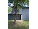 Back exterior of a gray home with siding and a small concrete patio at 615 Waynes Se Ct, Atlanta, GA 30354