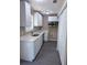 Bright kitchen with white cabinets, stainless steel appliances, modern countertops, and ample storage at 615 Waynes Se Ct, Atlanta, GA 30354