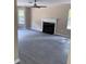 Cozy living room with a fireplace, wood-look floors, neutral walls, and natural light at 615 Waynes Se Ct, Atlanta, GA 30354