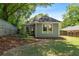 Backyard features a well-manicured lawn, a privacy fence, and mature trees at 1116 United Se Ave, Atlanta, GA 30316