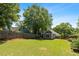 Spacious backyard features a well-manicured lawn, privacy fence, and mature trees at 1116 United Se Ave, Atlanta, GA 30316