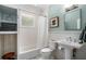 Cozy bathroom features subway tile, a tub, and a pedestal sink at 1116 United Se Ave, Atlanta, GA 30316