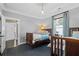 Bedroom with two twin beds, wood floors, and large window at 1116 United Se Ave, Atlanta, GA 30316
