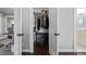 Walk-in closet with custom shelving, and adjacent to the ensuite bathroom at 1116 United Se Ave, Atlanta, GA 30316