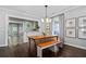 Charming dining room with hardwood floors, decorative lighting, bench seating, and view into the kitchen at 1116 United Se Ave, Atlanta, GA 30316