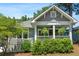 Charming craftsman-style home with a welcoming front porch and lush landscaping, perfect for relaxing and enjoying the outdoors at 1116 United Se Ave, Atlanta, GA 30316