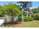 Charming craftsman-style home with a welcoming front porch and lush landscaping, perfect for relaxing and enjoying the outdoors at 1116 United Se Ave, Atlanta, GA 30316