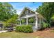Charming craftsman-style home with a welcoming front porch and lush landscaping, perfect for relaxing and enjoying the outdoors at 1116 United Se Ave, Atlanta, GA 30316