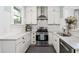 Bright kitchen with white cabinets, subway tile, stainless steel appliances, and tile flooring at 1116 United Se Ave, Atlanta, GA 30316