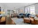 Bright living room featuring hardwood floors, large windows, and an open layout, ideal for entertaining and comfortable living at 1116 United Se Ave, Atlanta, GA 30316