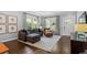 Bright living room featuring hardwood floors, large windows, and an open layout, ideal for entertaining and comfortable living at 1116 United Se Ave, Atlanta, GA 30316