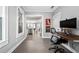 Comfortable home office space with tiled floors, natural light, and view into the kitchen and living areas at 1116 United Se Ave, Atlanta, GA 30316
