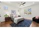 Charming bedroom with natural light, wood floors, stylish decor and a comfortable queen bed at 1183 Mobile Nw St, Atlanta, GA 30314