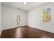 Bedroom with hardwood floors, natural light, and a private door to the outdoor porch at 1183 Mobile Nw St, Atlanta, GA 30314