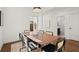 Bright dining room featuring modern chairs and neutral decor with an adjacent renovated bathroom at 1183 Mobile Nw St, Atlanta, GA 30314