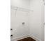 Bright and airy laundry room with modern fixtures and storage shelving at 1183 Mobile Nw St, Atlanta, GA 30314