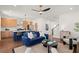 Open concept living room with modern kitchen, hardwood floors, and staircase at 1183 Mobile Nw St, Atlanta, GA 30314