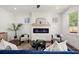 Bright and airy living room with a modern fireplace, hardwood floors, and ample natural light at 1183 Mobile Nw St, Atlanta, GA 30314