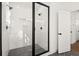 Modern shower with glass door, dual shower heads, and sleek tile work at 1183 Mobile Nw St, Atlanta, GA 30314