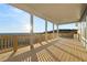 Expansive back deck with wood railing offers stunning views of the surrounding landscape at 231 Laurel Vista Dr, Canton, GA 30114