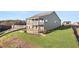 Backyard view shows multi-level deck and large backyard on a sunny day at 231 Laurel Vista Dr, Canton, GA 30114