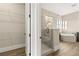 Bathroom featuring glass shower, soaking tub, and vanity with sink and countertop at 231 Laurel Vista Dr, Canton, GA 30114