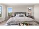 Bedroom featuring tufted headboard and scenic outside views at 231 Laurel Vista Dr, Canton, GA 30114
