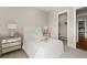 Bedroom with neutral tones, stylish mirrored dresser, and a walk-in closet at 231 Laurel Vista Dr, Canton, GA 30114