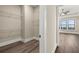 Walk-in closet featuring wire shelving and hardwood floors, located off hallway near bedroom at 231 Laurel Vista Dr, Canton, GA 30114