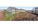 Exterior rear view shows the deck of this two-story home with large backyard at 231 Laurel Vista Dr, Canton, GA 30114