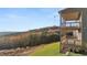 Spacious home featuring an outdoor wood deck offering breathtaking views of the surrounding landscape and hills at 231 Laurel Vista Dr, Canton, GA 30114