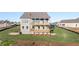 Exterior view shows multi-level deck and large backyard, perfect for outdoor activities at 231 Laurel Vista Dr, Canton, GA 30114