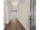 Inviting hallway with wood floors and modern trim leading to open living space at 231 Laurel Vista Dr, Canton, GA 30114