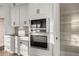 Modern kitchen featuring built-in microwave and oven, white cabinets and access to a pantry room at 231 Laurel Vista Dr, Canton, GA 30114