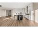 Spacious open floor plan with island in kitchen featuring stainless steel appliances and wood floors at 231 Laurel Vista Dr, Canton, GA 30114