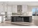 Modern kitchen with stainless appliances, central island, and ample cabinet space at 231 Laurel Vista Dr, Canton, GA 30114