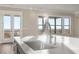 Bright and open kitchen with kitchen island, farm sink, gooseneck faucet and view of the outdoor deck at 231 Laurel Vista Dr, Canton, GA 30114